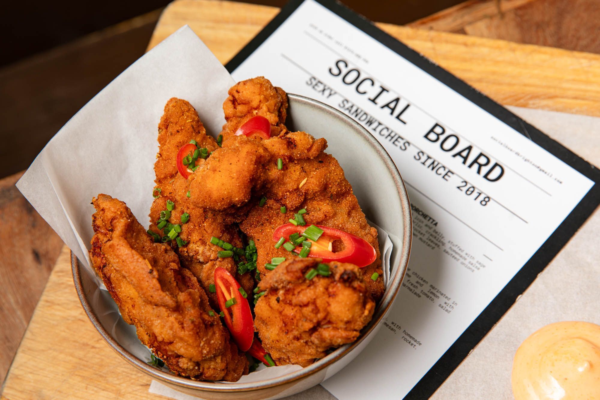 close up shot of the fried chicken served in the white bowl at Social Board Brighton