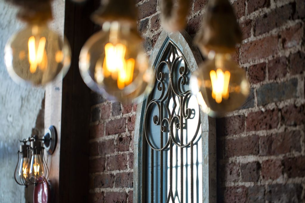 Interior of Shandiz restaurant in Brighton. brick facade wall and wrought iron