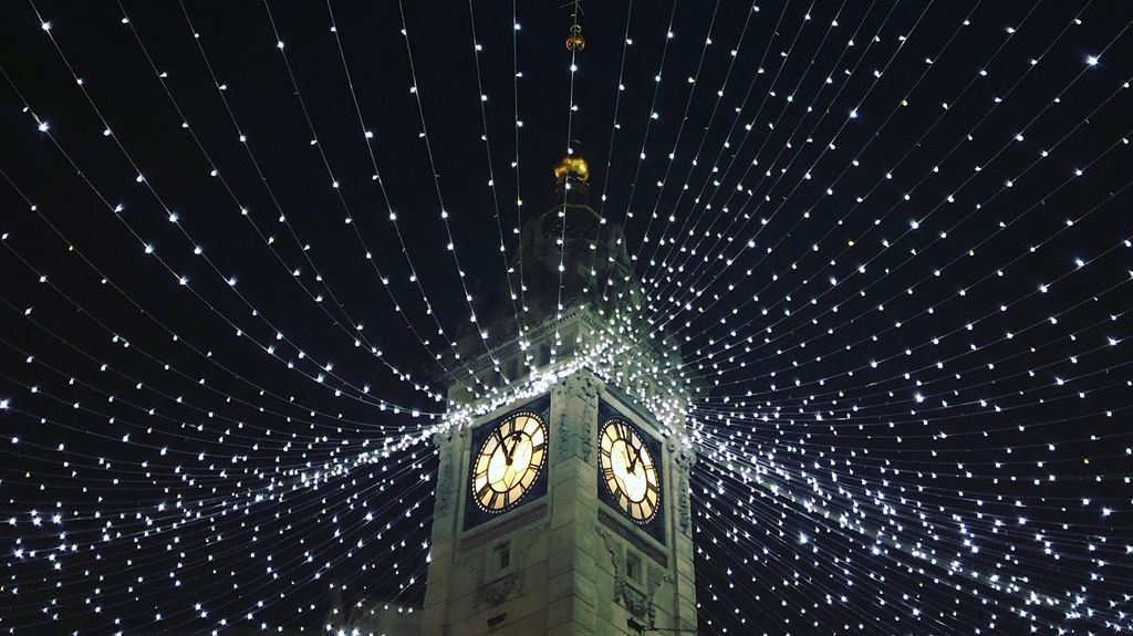 Things to do in Brighton. Pictured the Brighton Christmas clocktower which consists of sparkly lights connected to a tall clock tower.