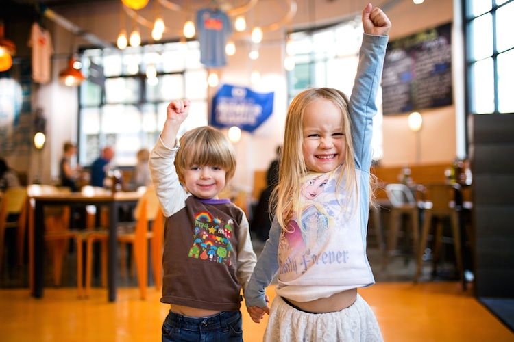 Kids cheering inside Italian restaurant Nuposto