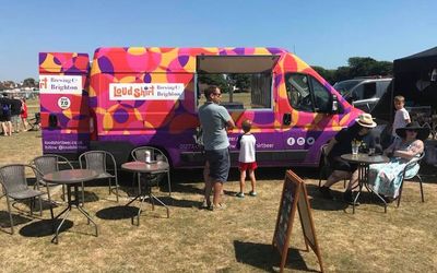 Takeaway beer van at a festival with a customer