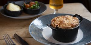 Individual meat free pie with vegetables and a glass of beer