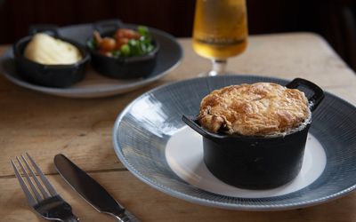 Individual meat free pie with vegetables and a glass of beer