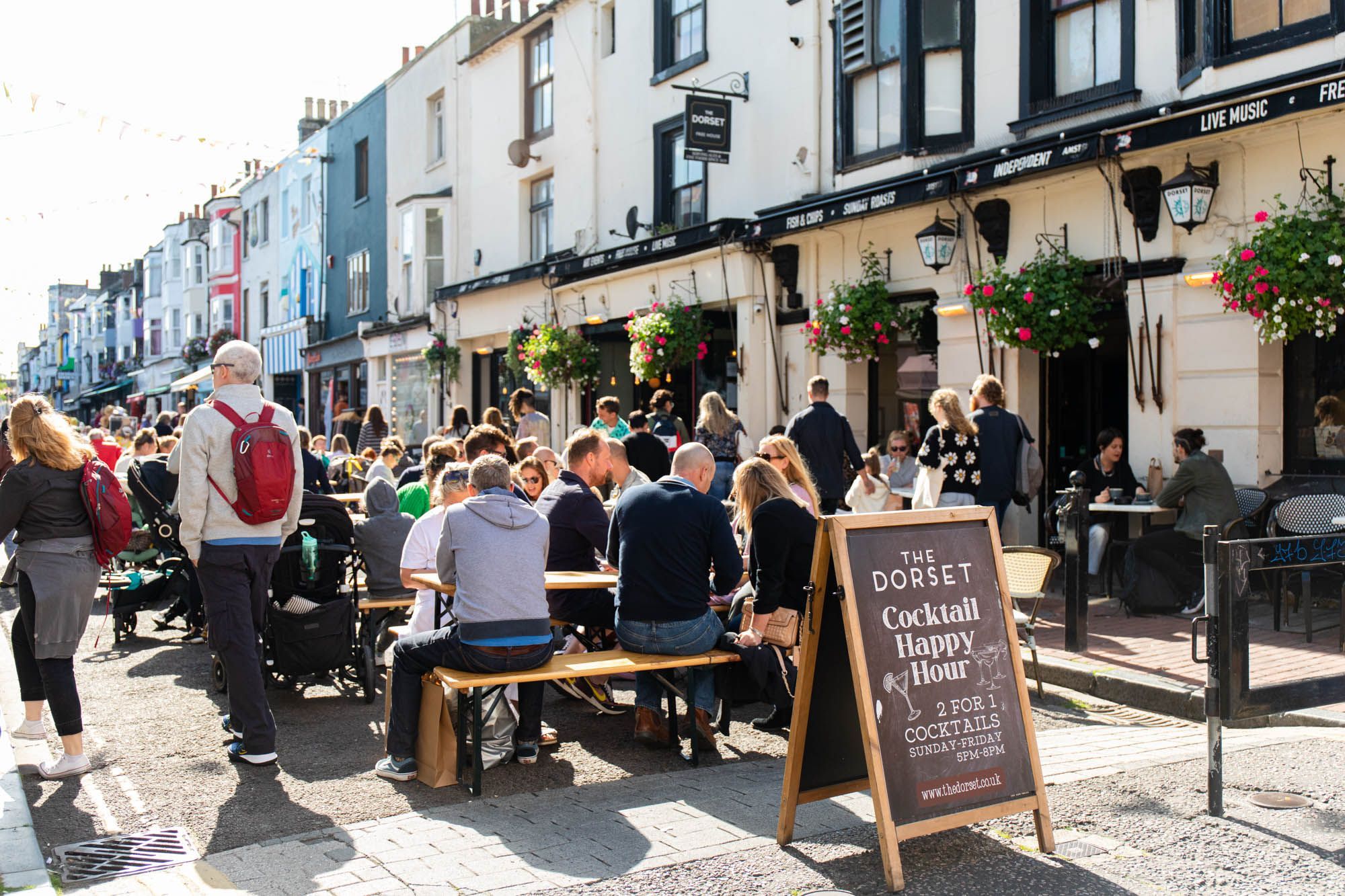 outdoor seating populated with people at the Dorset