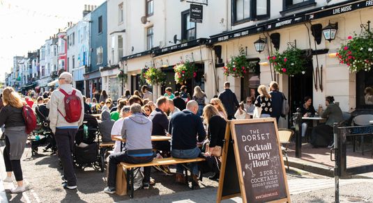 outdoor seating populated with people at the Dorset. North Laine Brighton