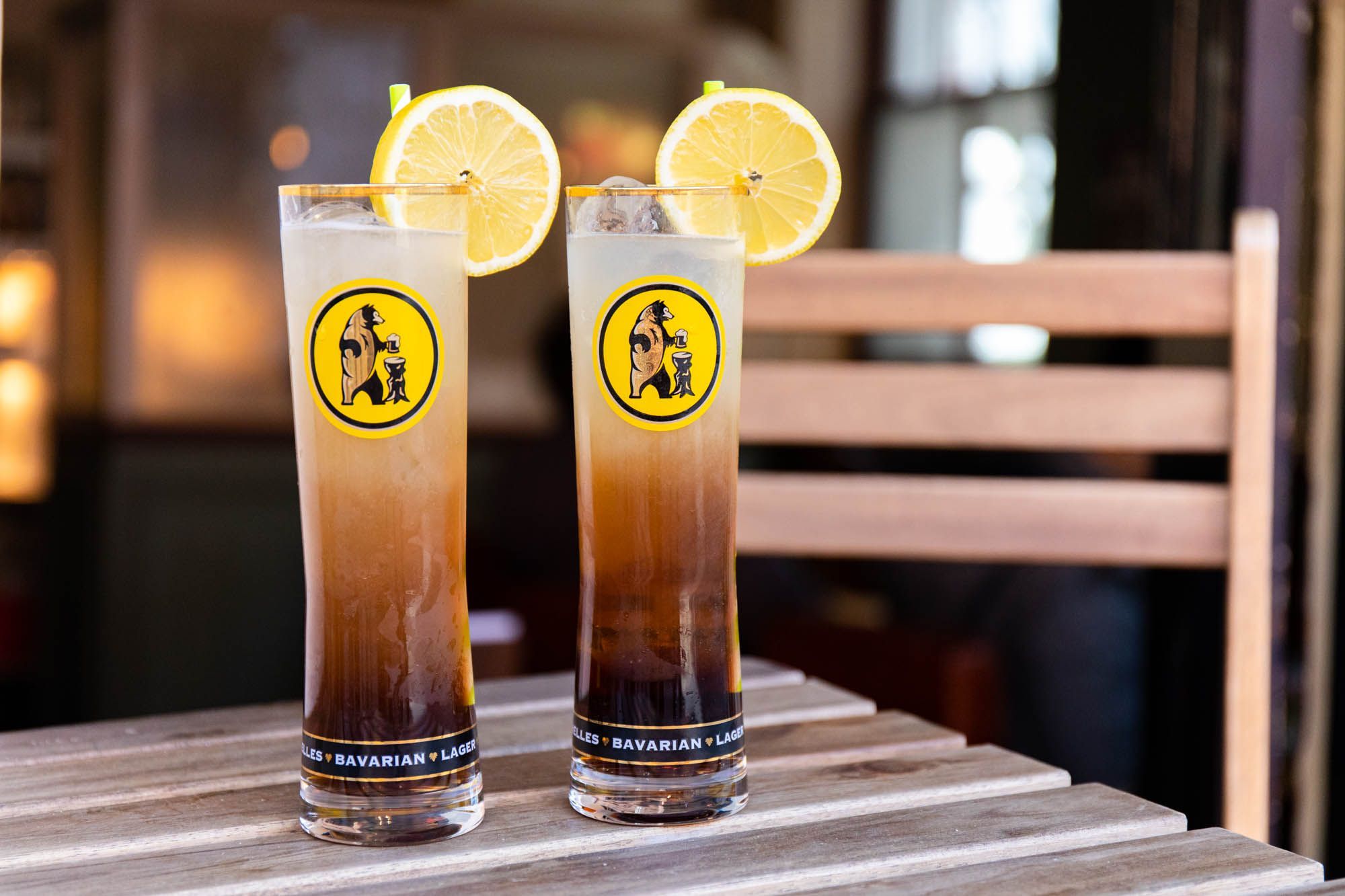 two big glasses of white and brown looking drink, decorated with pieces of lemon. The Dorset Brighton