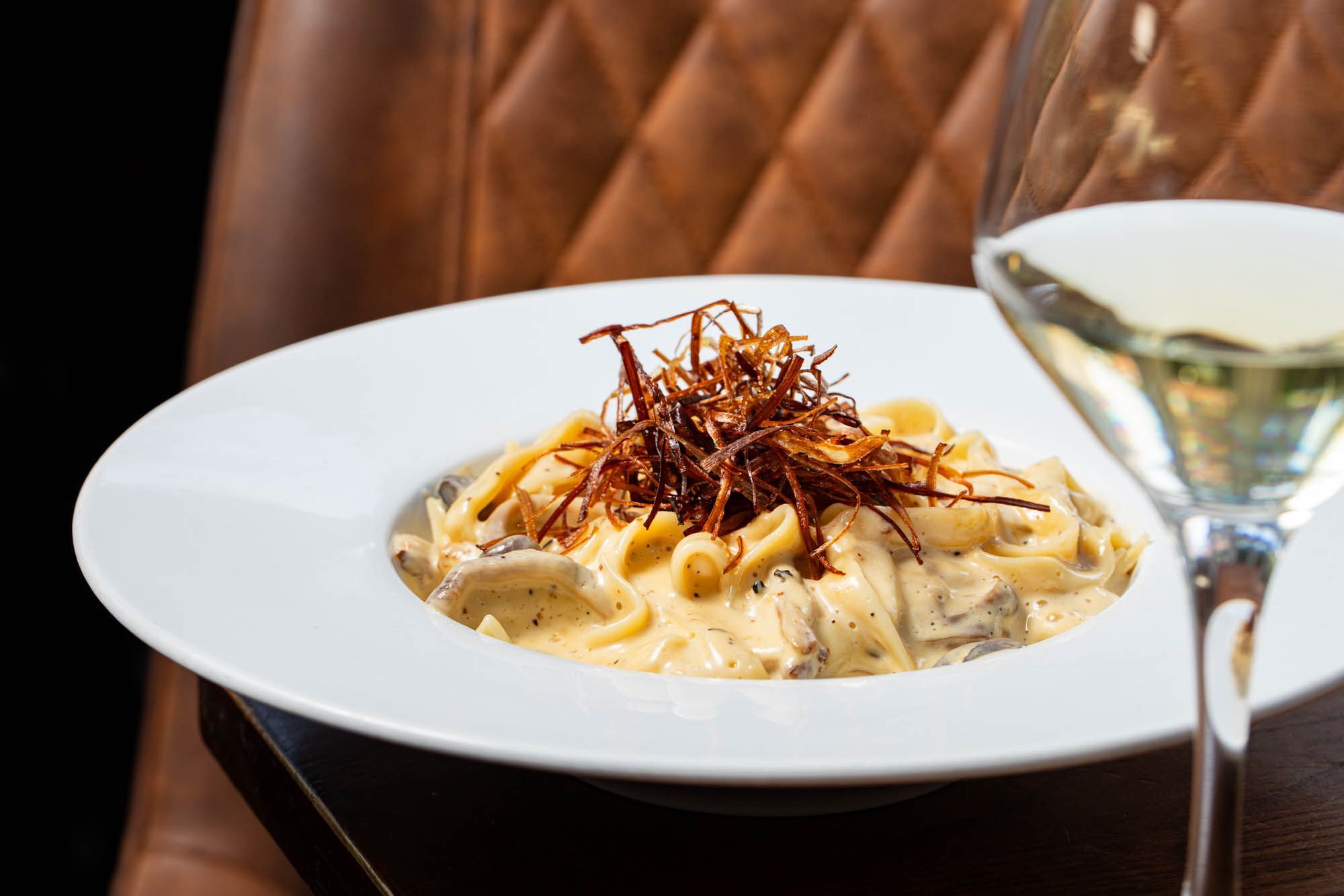 close up shot of the pasta and cream dish served with white wine at Cleveland Arms