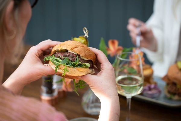hands holding burger