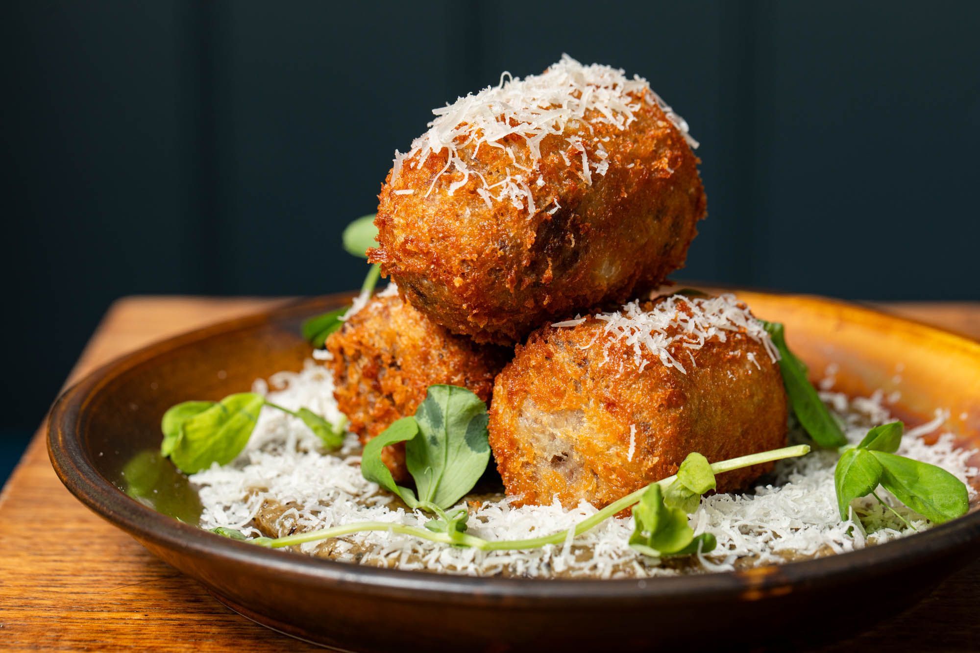 close up shot of the croquetes served with great cheese