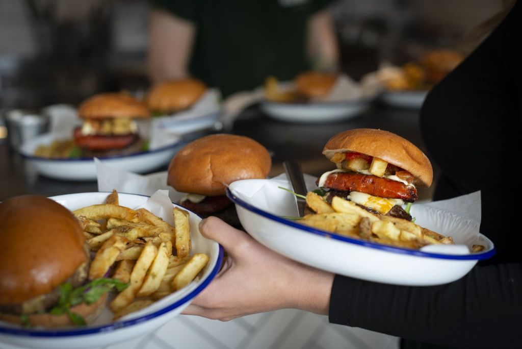 Burgers and fries in brioche buns served on enamel dishes. Honest burgers at the Fortune of War. Brighton seafront restaurants
