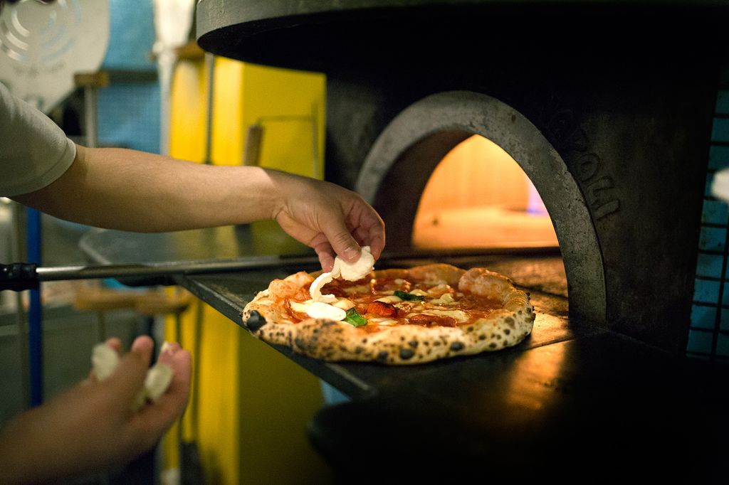 pizza oven from Napoli and speckled sourdough pizza