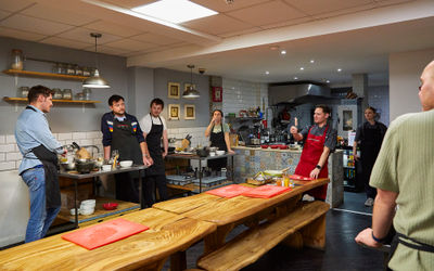 chef Victor talking to participants of the Brighton Cookery School cooking class