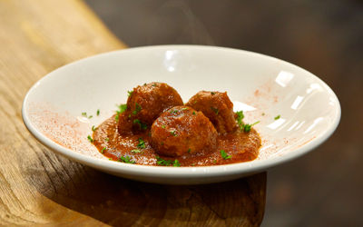 meat balls served in white plate