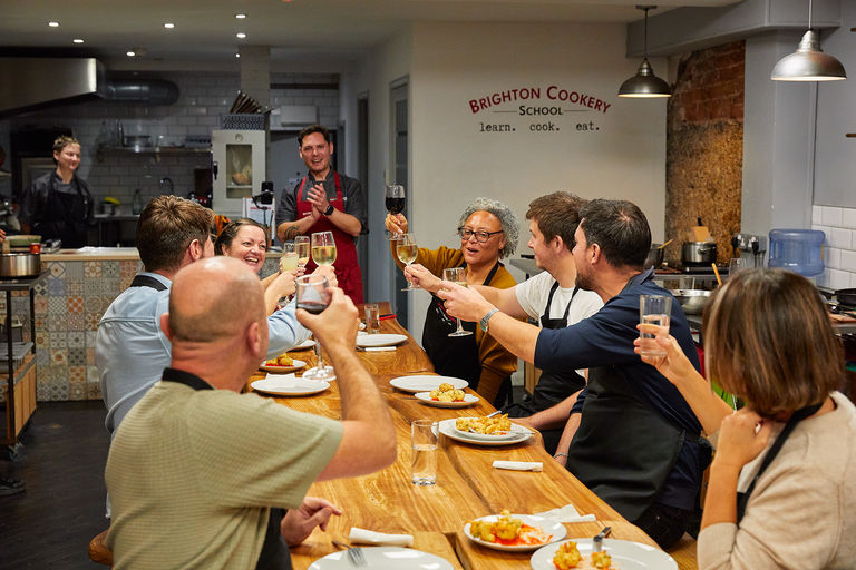 participants of cooking class at Brighton Cookery School enjoying their cooked meal