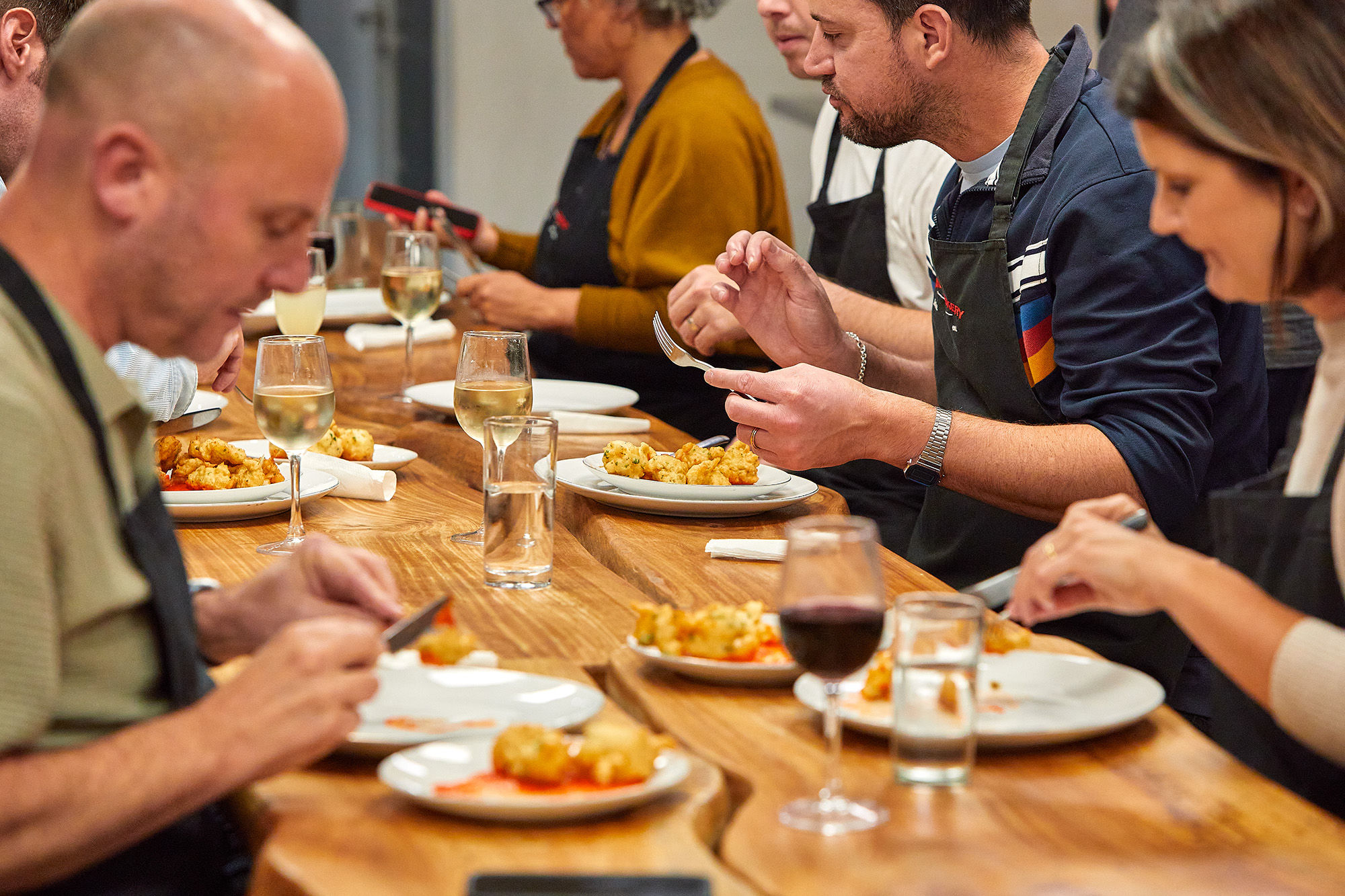 close up shot of the people dining the food they cooked during cooking class