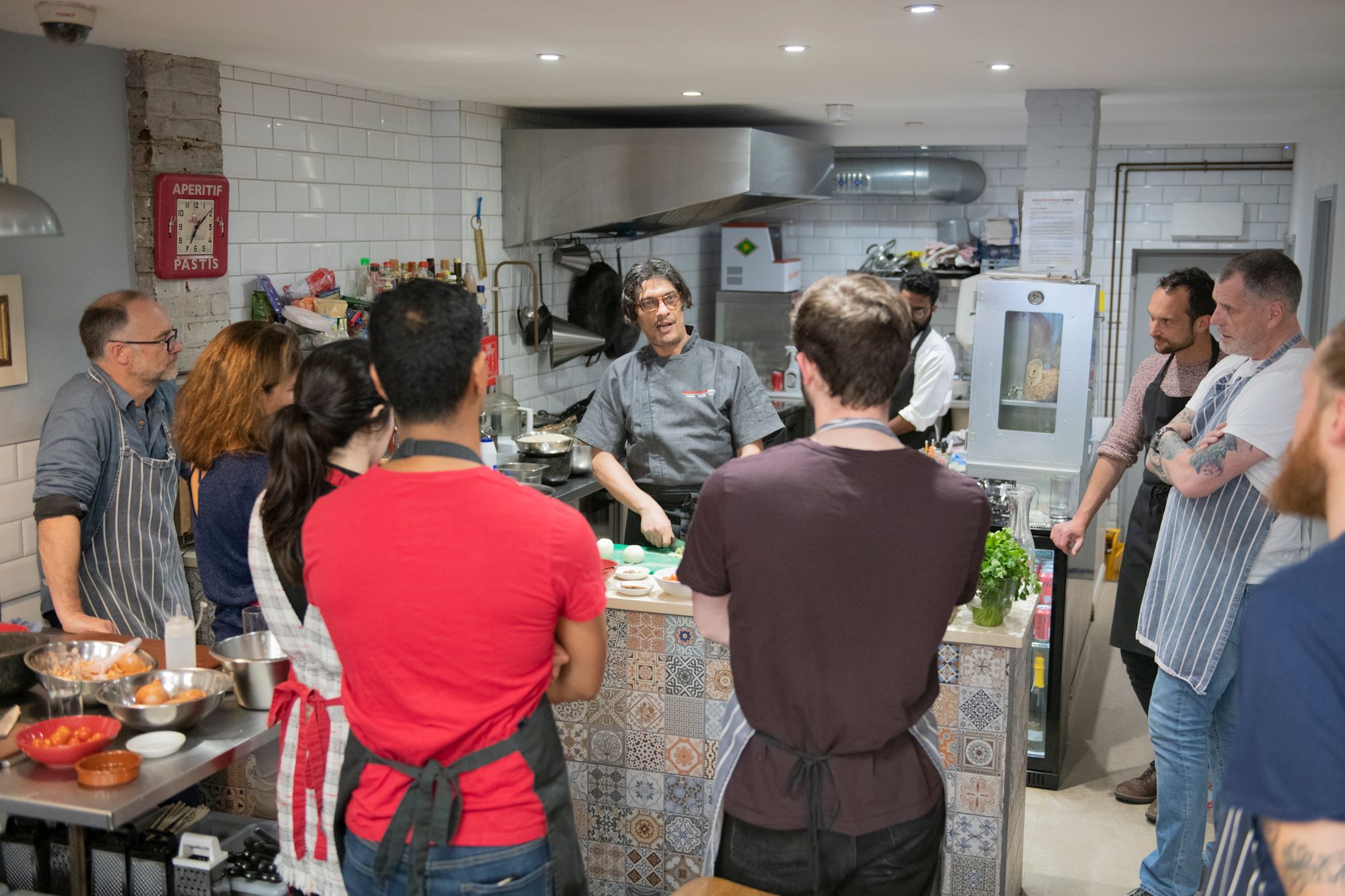 group of people listening chef during the broghton coookery class
