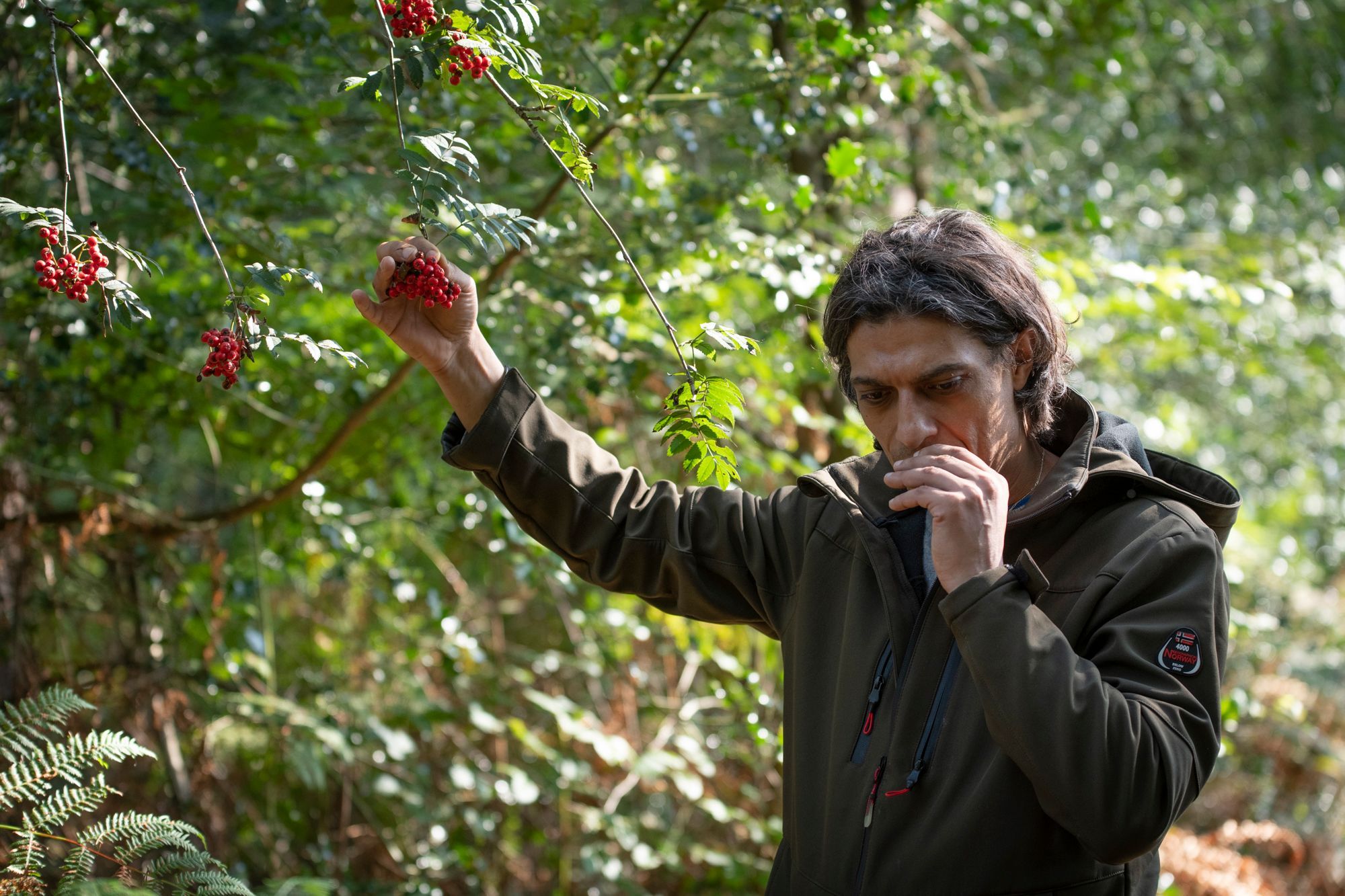 Ben checking the smell of redcurrants. Thai Cooking class