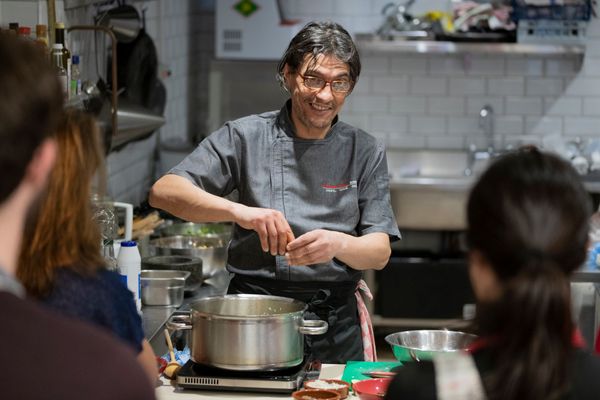 chef Ben smiling while educating others on cooking. Brighton catering