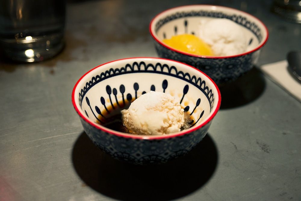 Sorbet in ceramic bowl on metal table