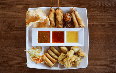 Thai mixed starters, prawn crackers, chicken satay, spring rolls and tempura vegetables