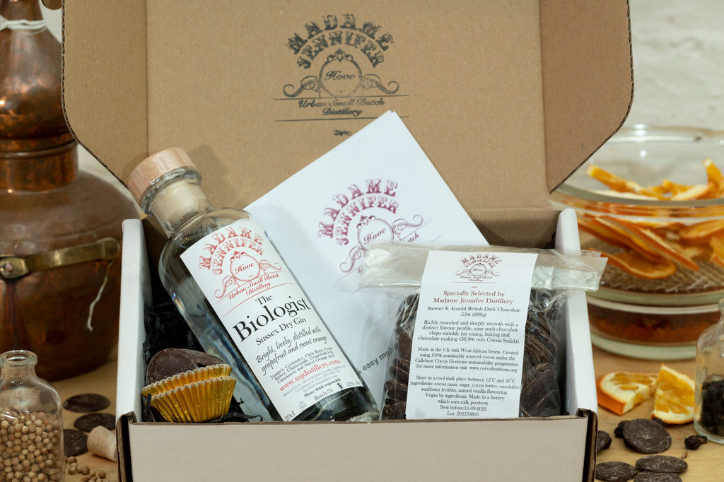 Boozy truffle DIY kit, a bottle of spirits some chocolates, chocolate cases and instructions on how to make truffles in a presentation box