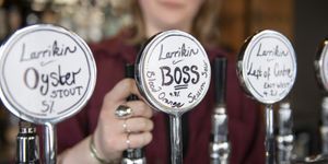 Beer taps with handwritten labels for Larrikin ales and stout