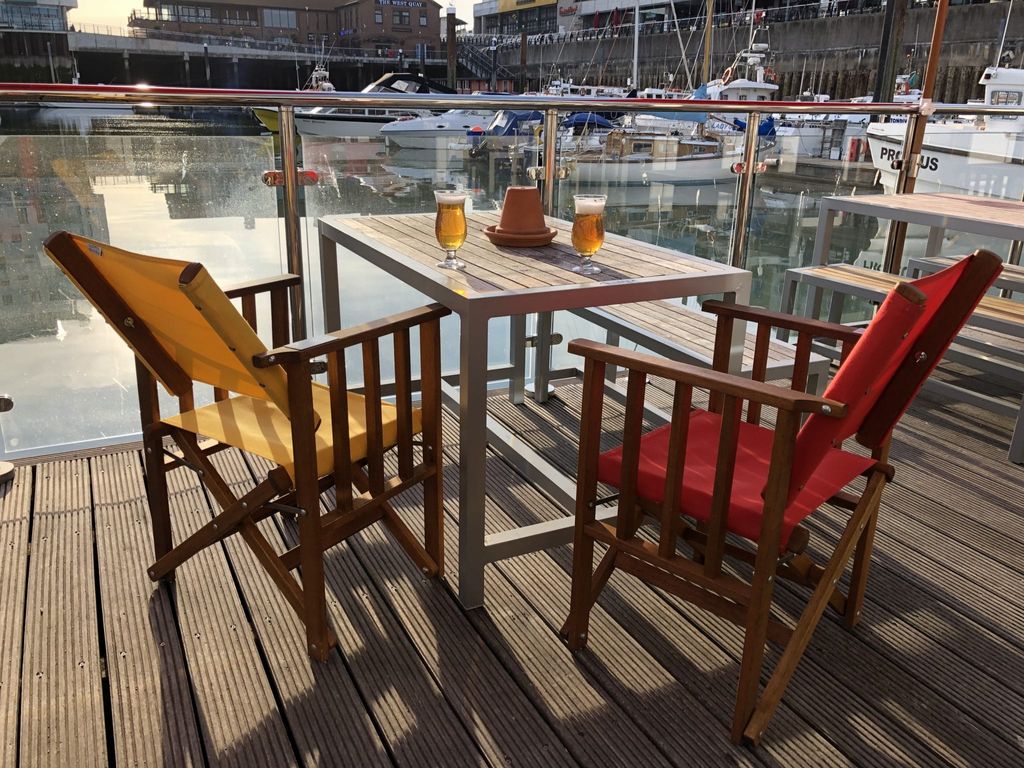 Canvas chairs with marina view