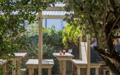 Alfresco seating in the beer garden with plants and foliage