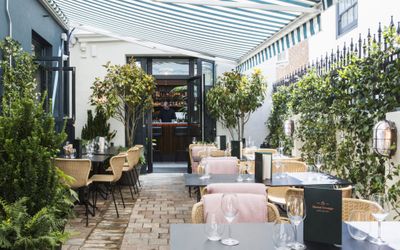 A view through the flagstone courtyard at Burnt Orange. Nestled in the Lanes Brighton