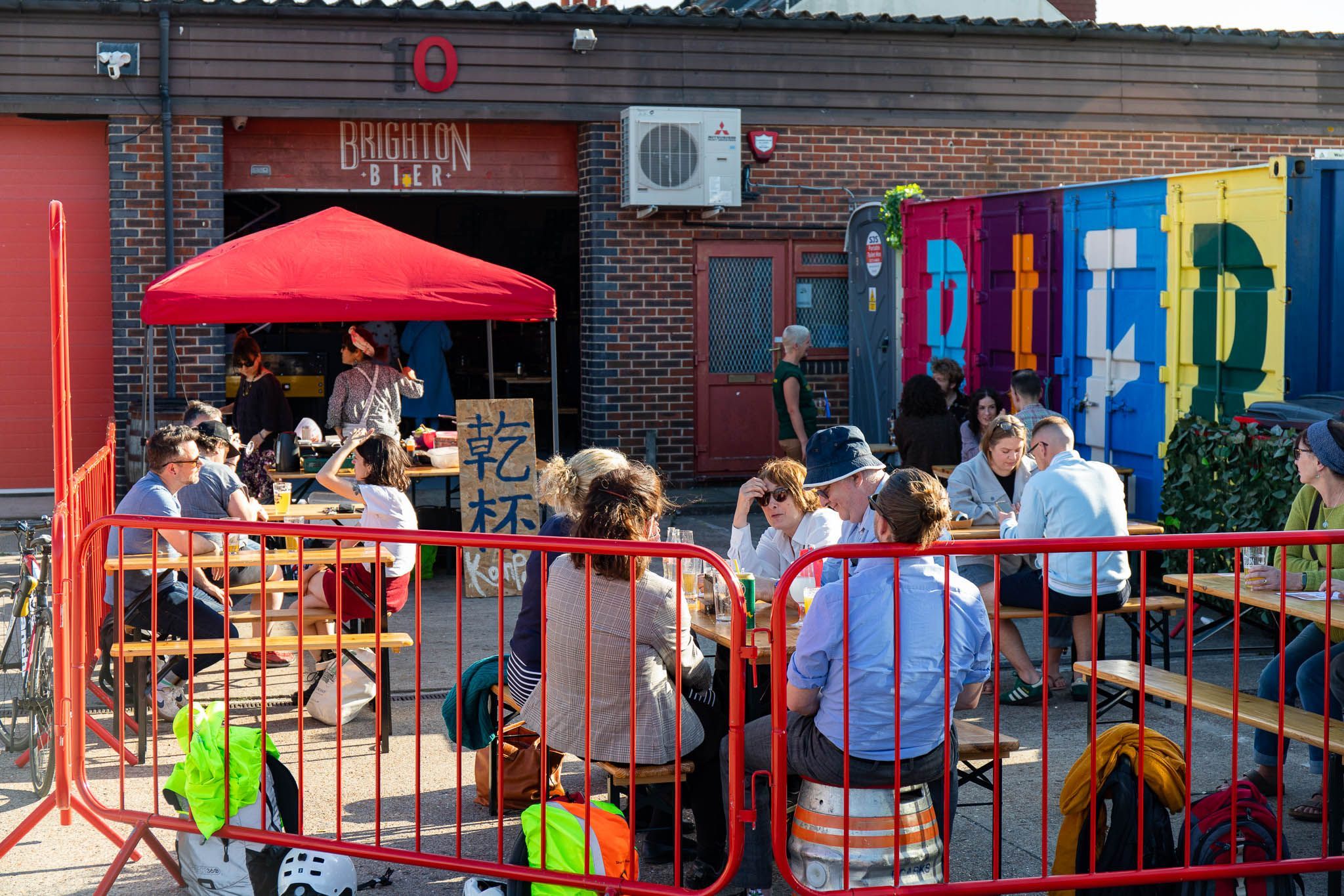 people sitting outside the brighton bier brewery