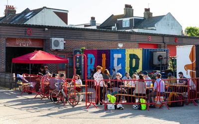 people sitting outside the brighton bier brewery