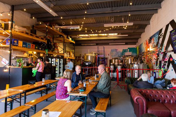 inside the brighton brewery taproom, people sitting and enjoying their beer