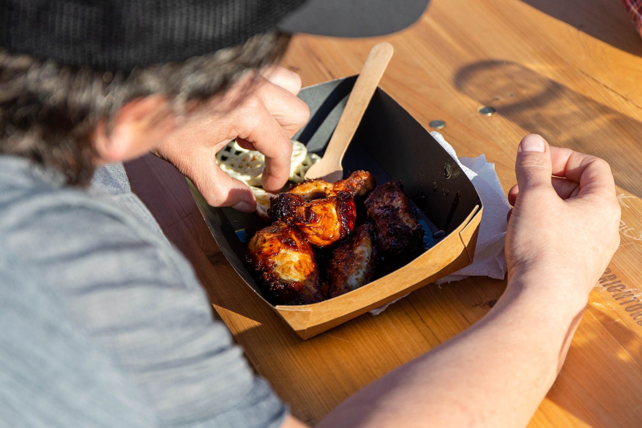 over head shot of the person eating chicken wings