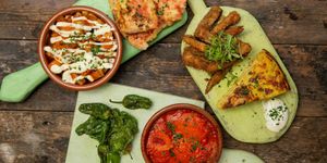 overhead shot of tapas dishes on a wooden table