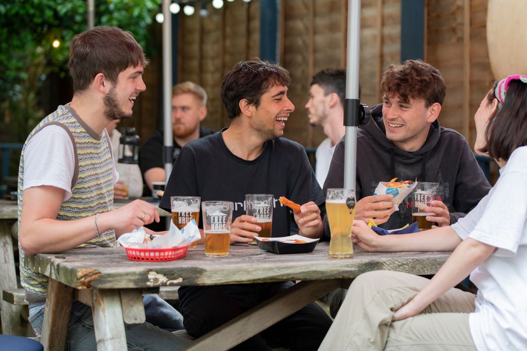 group of people enjoying beer in pubs garden