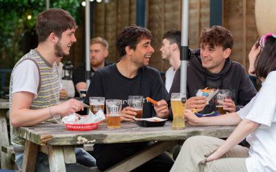 group of people enjoying beer in pubs garden