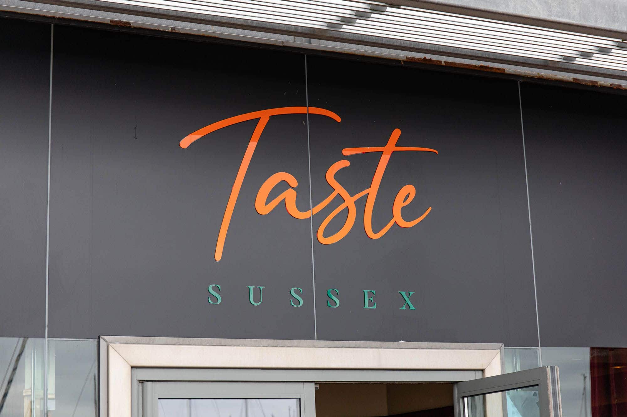 taste sussex logo above the enterance door