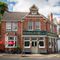 pub with traditional red brick and classic hung sash windows