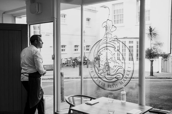 Chef Duncan Ray in the door of his restaurant, The Little Fish Market