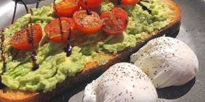 Avocado on toast with two poached eggs