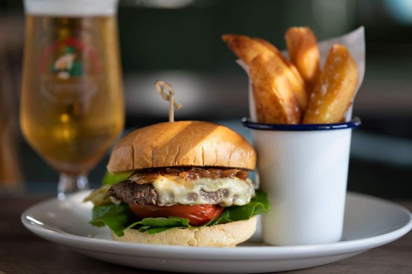 burger with chips and glass of beer