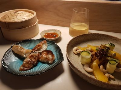 mango and courgette salad, gyoza, bamboo steamer and white wine