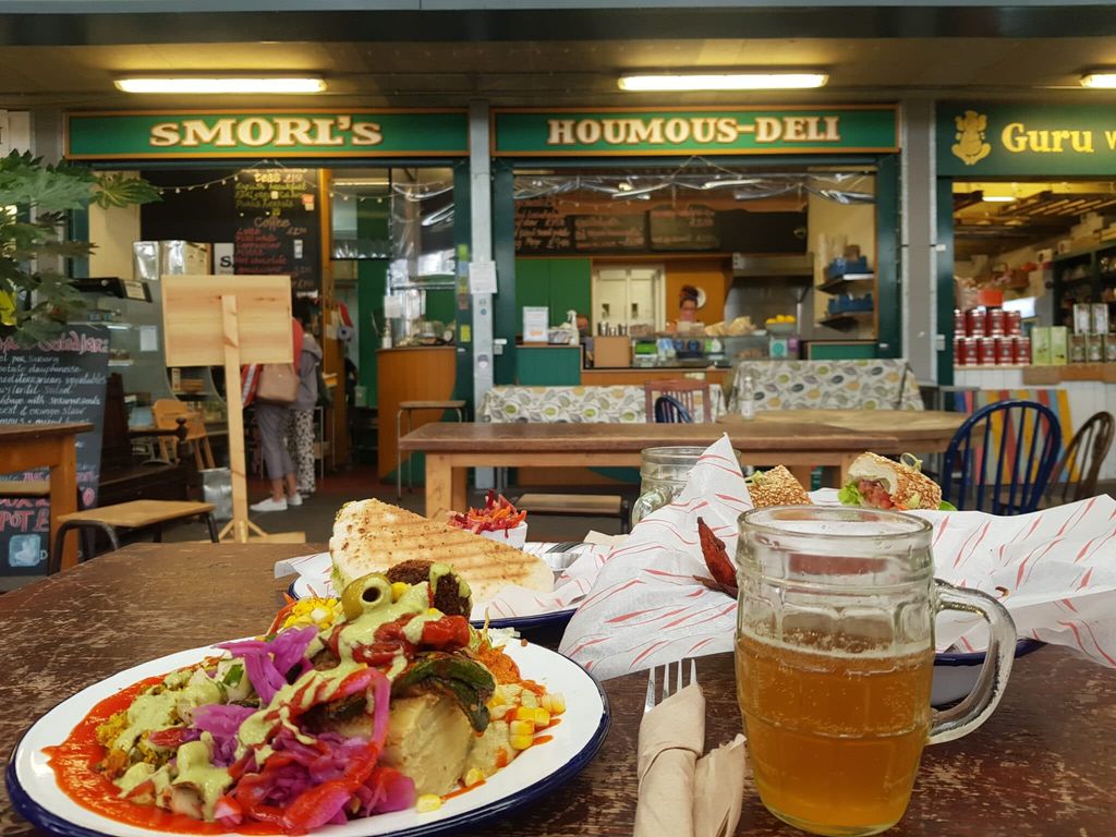 View over plates of food to vegan deli, Smorl's