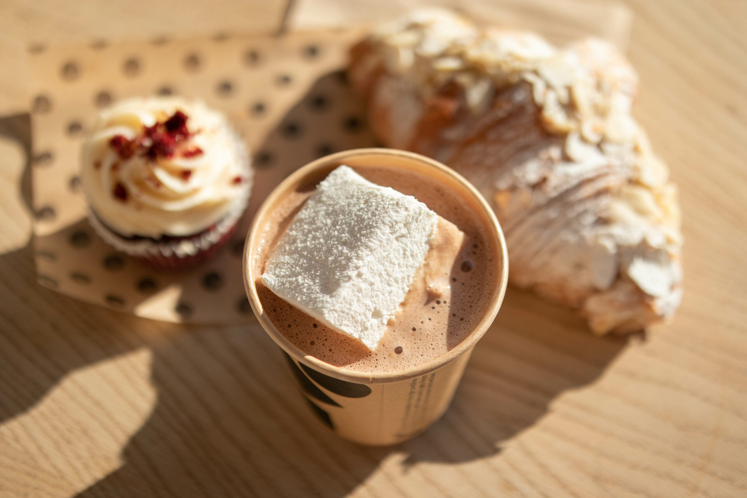 over head shot of the cup of knoops hot chocolate with marshallow melting inside of it