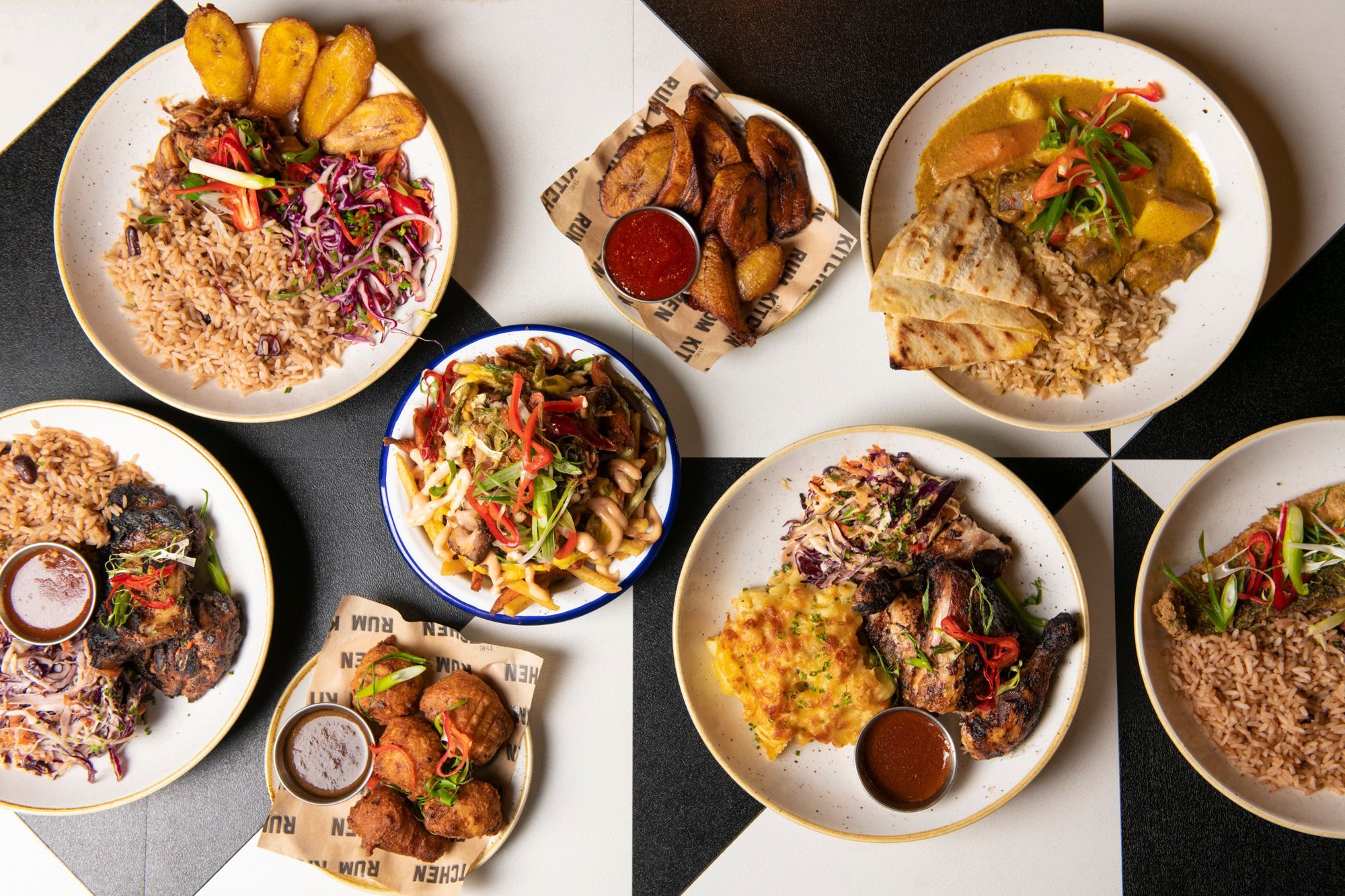 table laid out with caribbean dishes