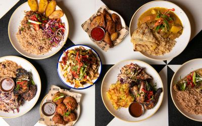 table laid out with caribbean dishes