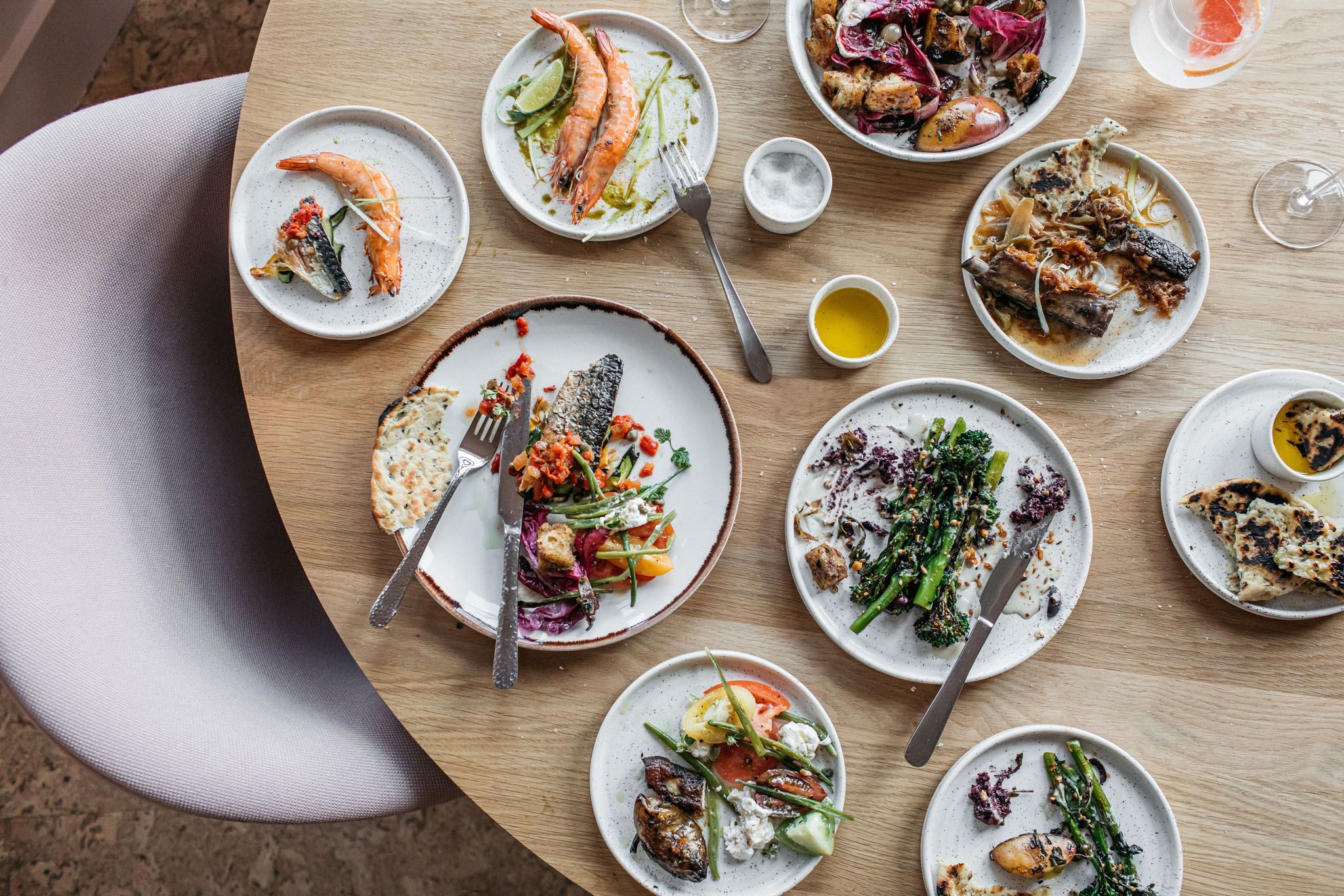 overhead shot of table laid out with small plates and drinks - Port Hotel Eastbourne