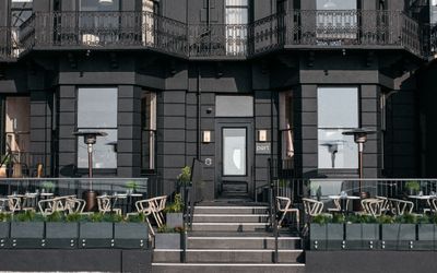 black exterior walls at Port Hotel in Eastbourne. A black facade of this boutique hotel. An Eastbourne seafront restaurant and hotel