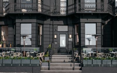 black exterior walls at Port Hotel in Eastbourne. A black facade of this boutique hotel. An Eastbourne seafront restaurant and hotel