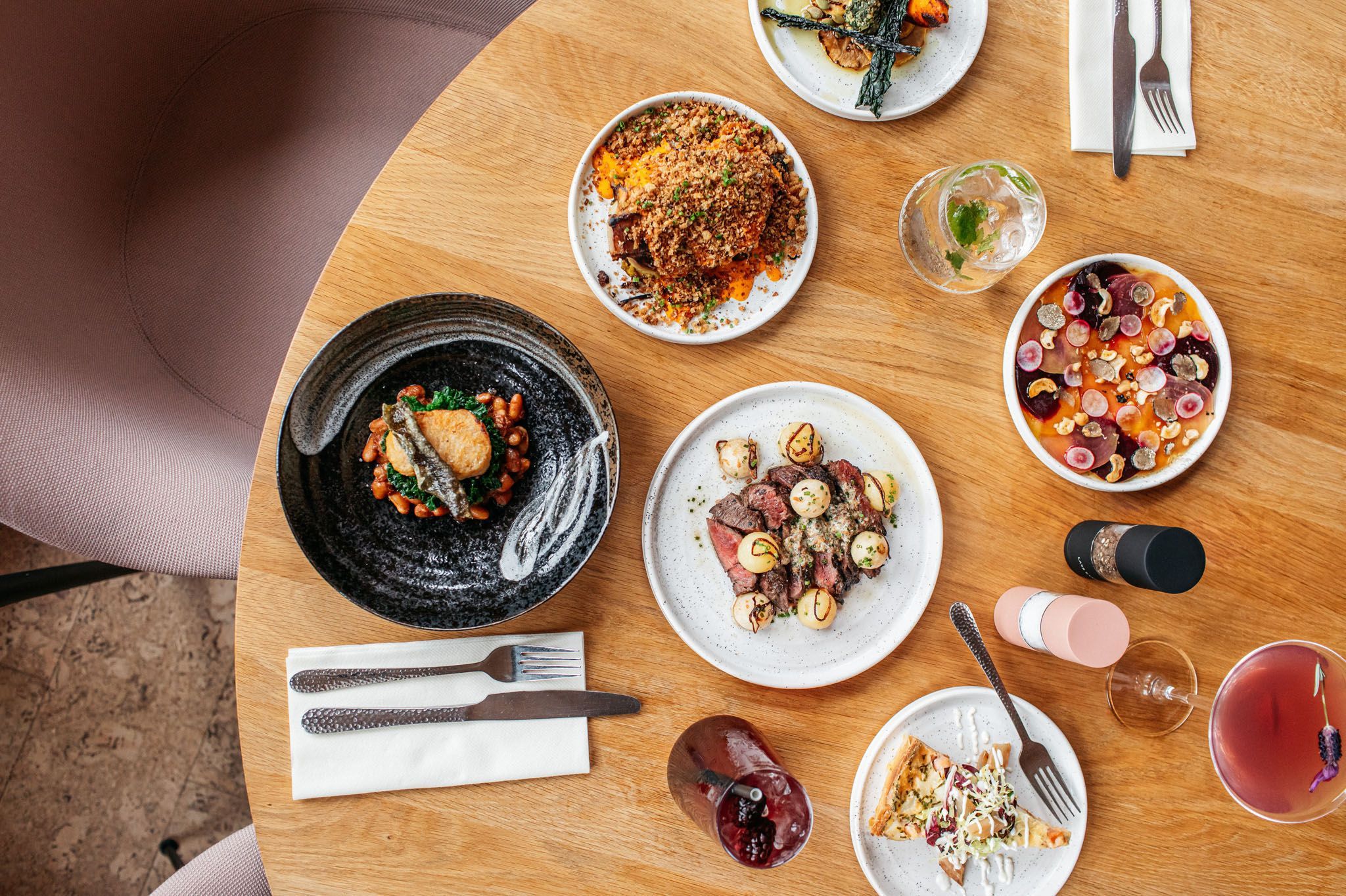 overhead shot of the table laid out with small plates and wine glasses